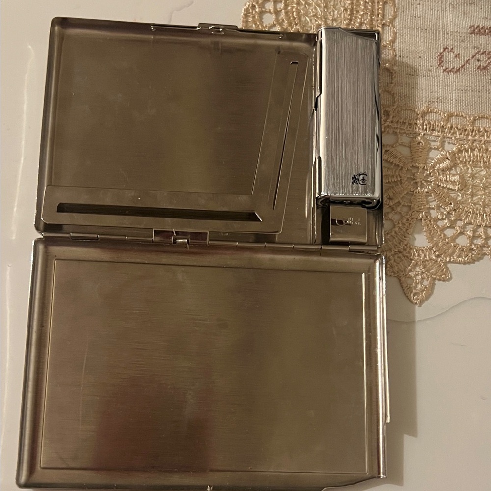 Vintage Colibri cigarette case with a built-in lighter.